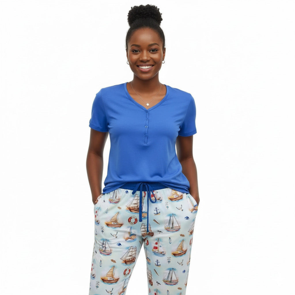 Woman wearing Kai Blue Bamboo shirt and joggers with sailboats