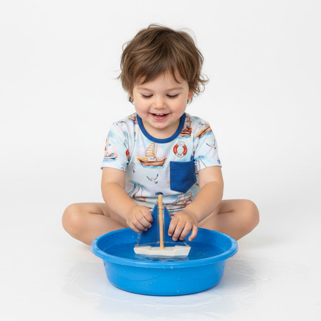 Child wearing bamboo tee shirt with pocket Kai Blue