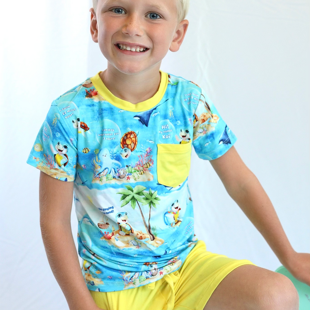 Boy wearing two piece shorts and tee shirt set from Kai Blue - Meet Kai collection
