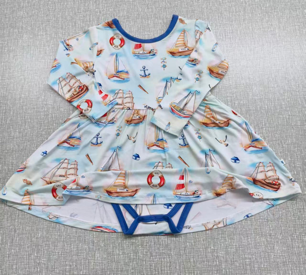 Flat lay of Bodysuit Twirl Dress with Sailing Print by Kai Blue