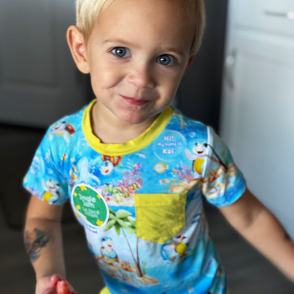 boy dancing in bamboo pocket tee shirt and shorts - Kai the Sea Turtle print by Kai Blue™