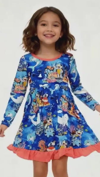 Girl dancing in ocean-themed bamboo dress by Kai Blue