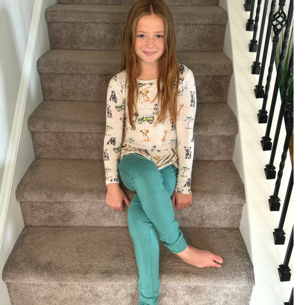 Young girl wearing Kai Blue™ Bamboo with safari print