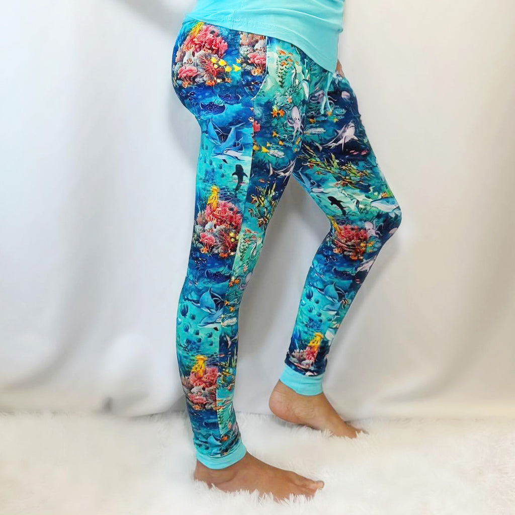 Woman standing in Women's Bamboo Joggers with ocean themed print